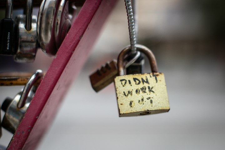 tarnished-gold-padlock-with-didn’t-work-out-message-attached-to-chain